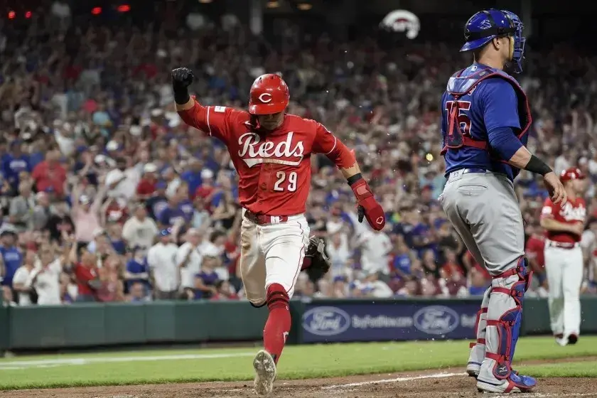 Cincinnati Reds player scoring a run