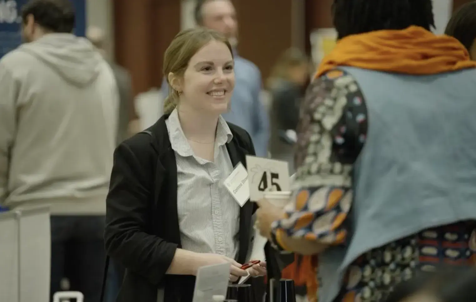 People socializing at a career fair