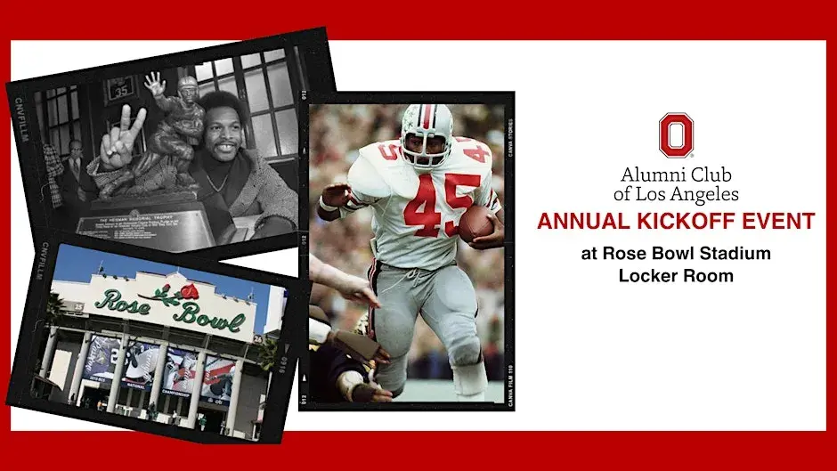 archie griffin holds up two fingers while posing with heisman trophy