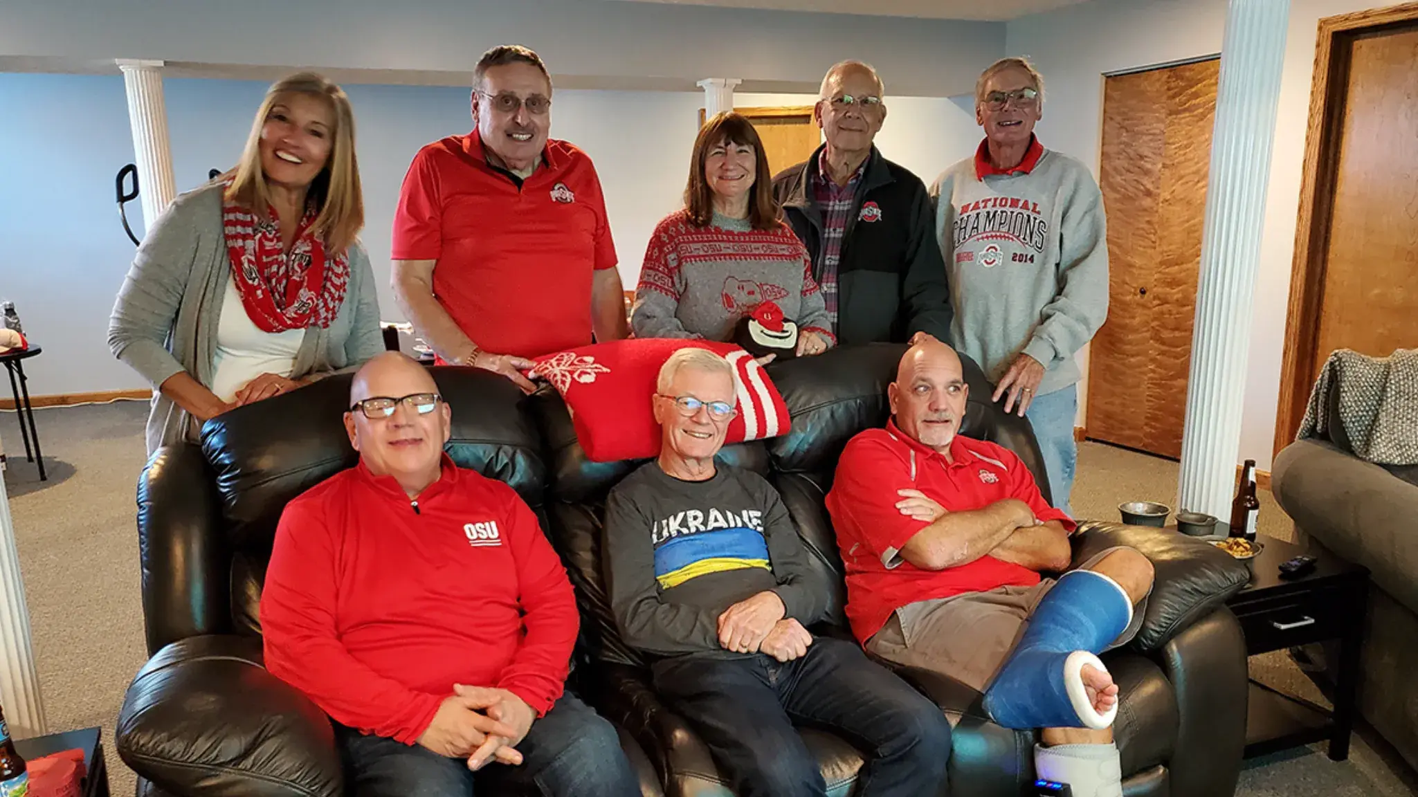 small group of ohio state alumni posing for a photo on couches