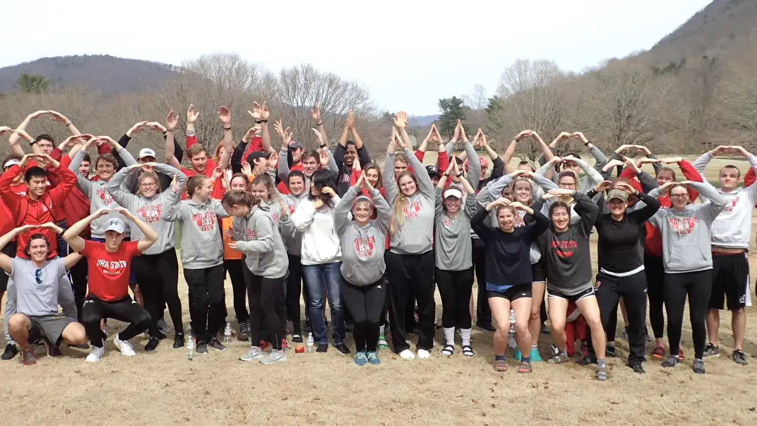 group of ohio state alumni gather to for O-H-I-O at a volunteering event