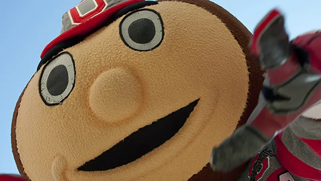 brutus buckeye pointing at the camera on game day
