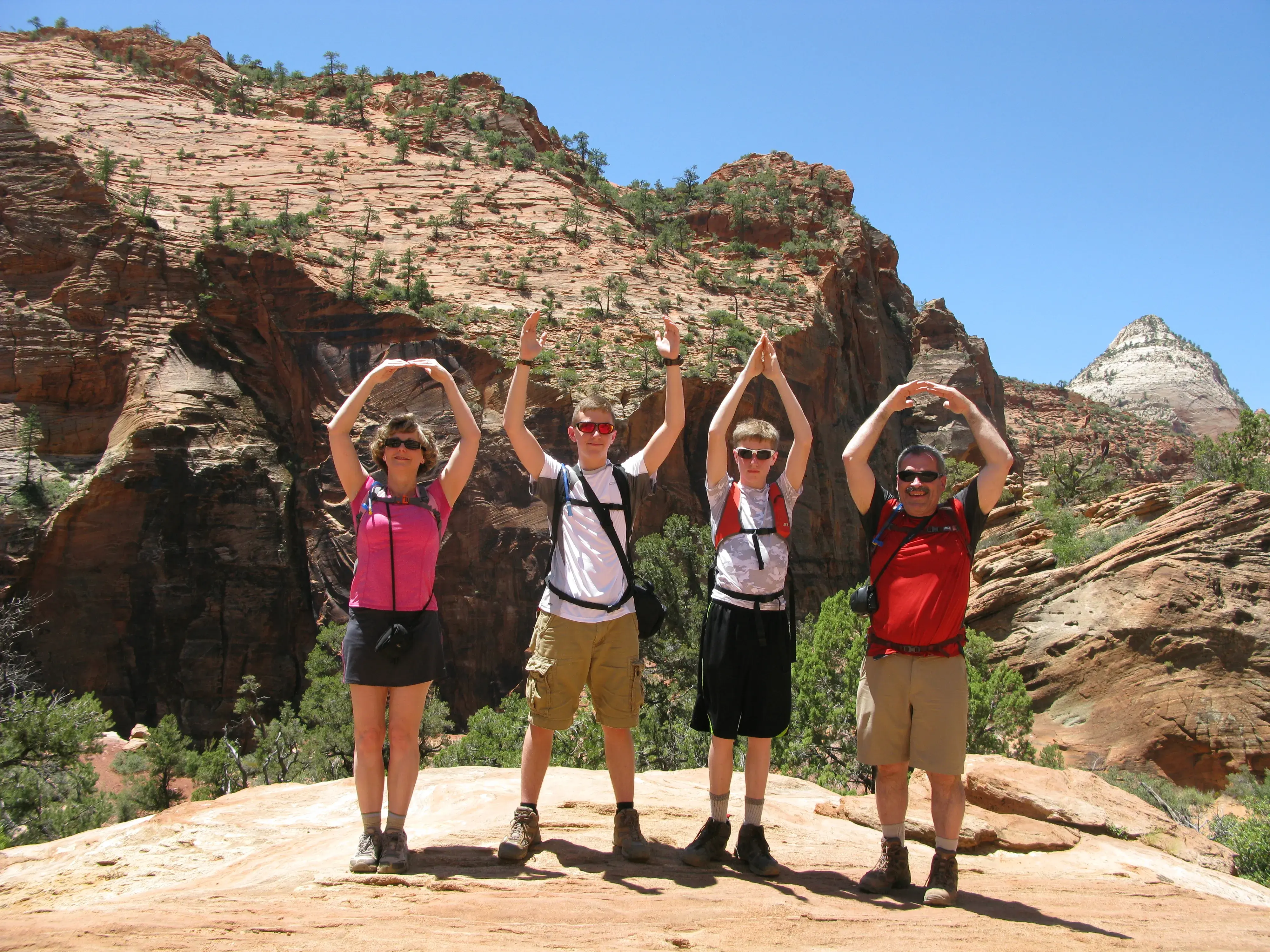 four people pose for o-h-i-o photo