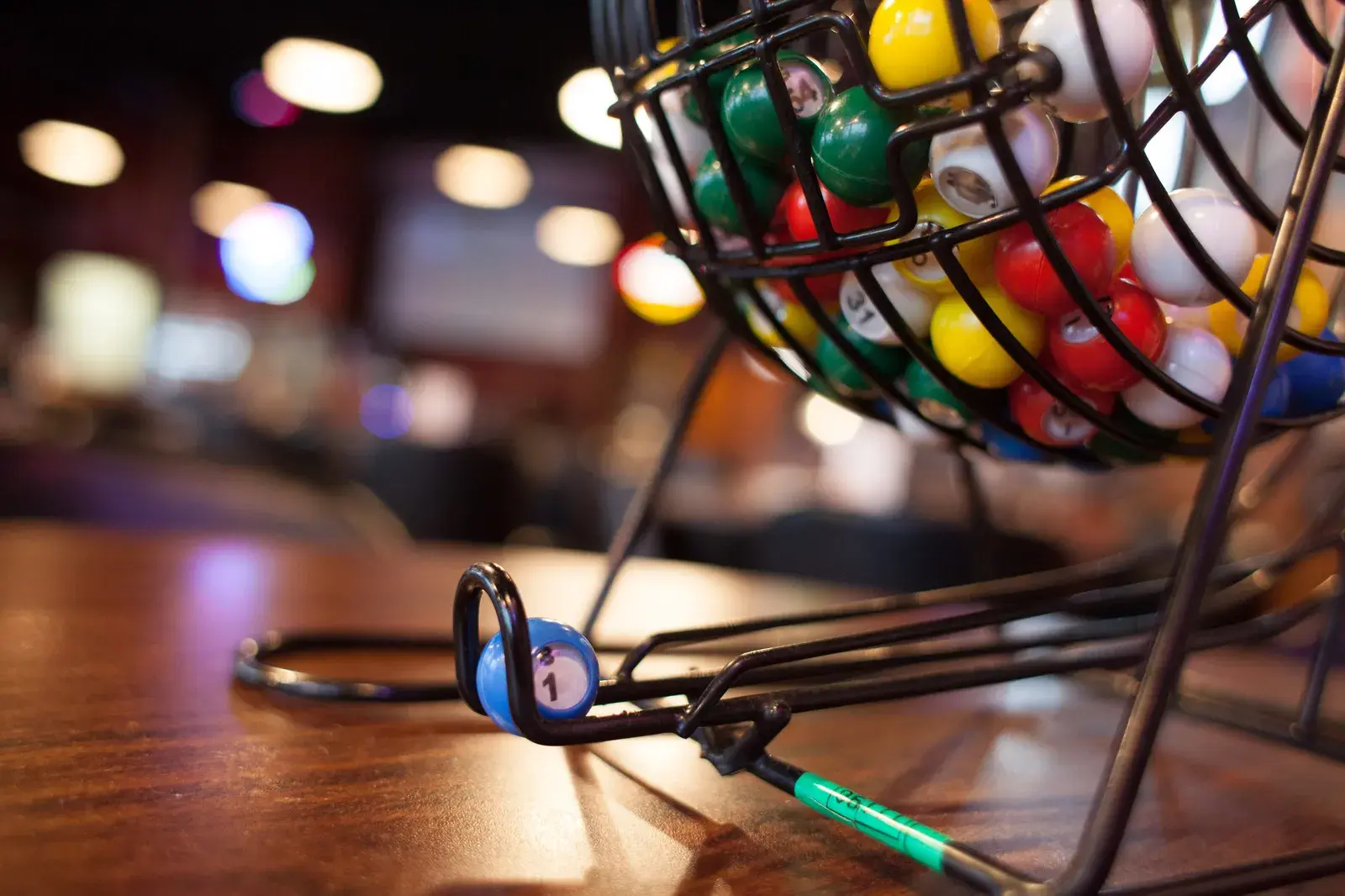Bingo balls in a metal cage