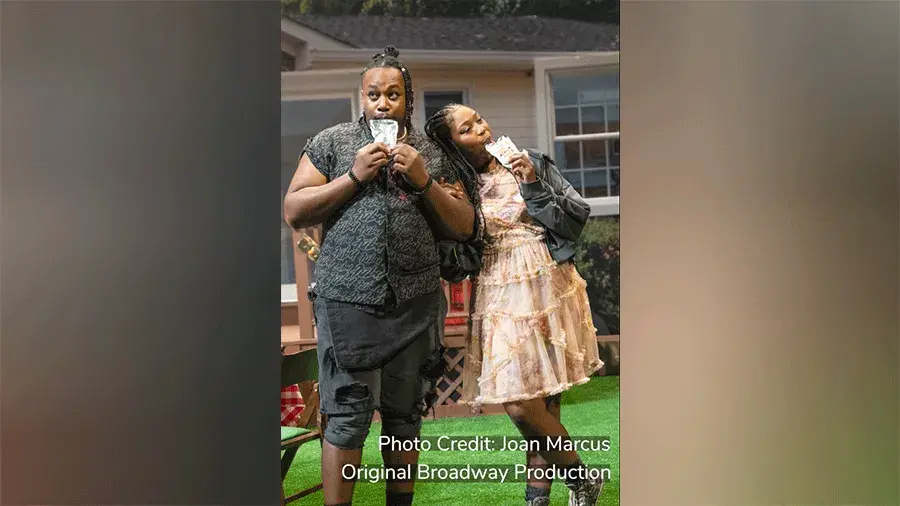 Two actors on set and in costume in the play FAT HAM