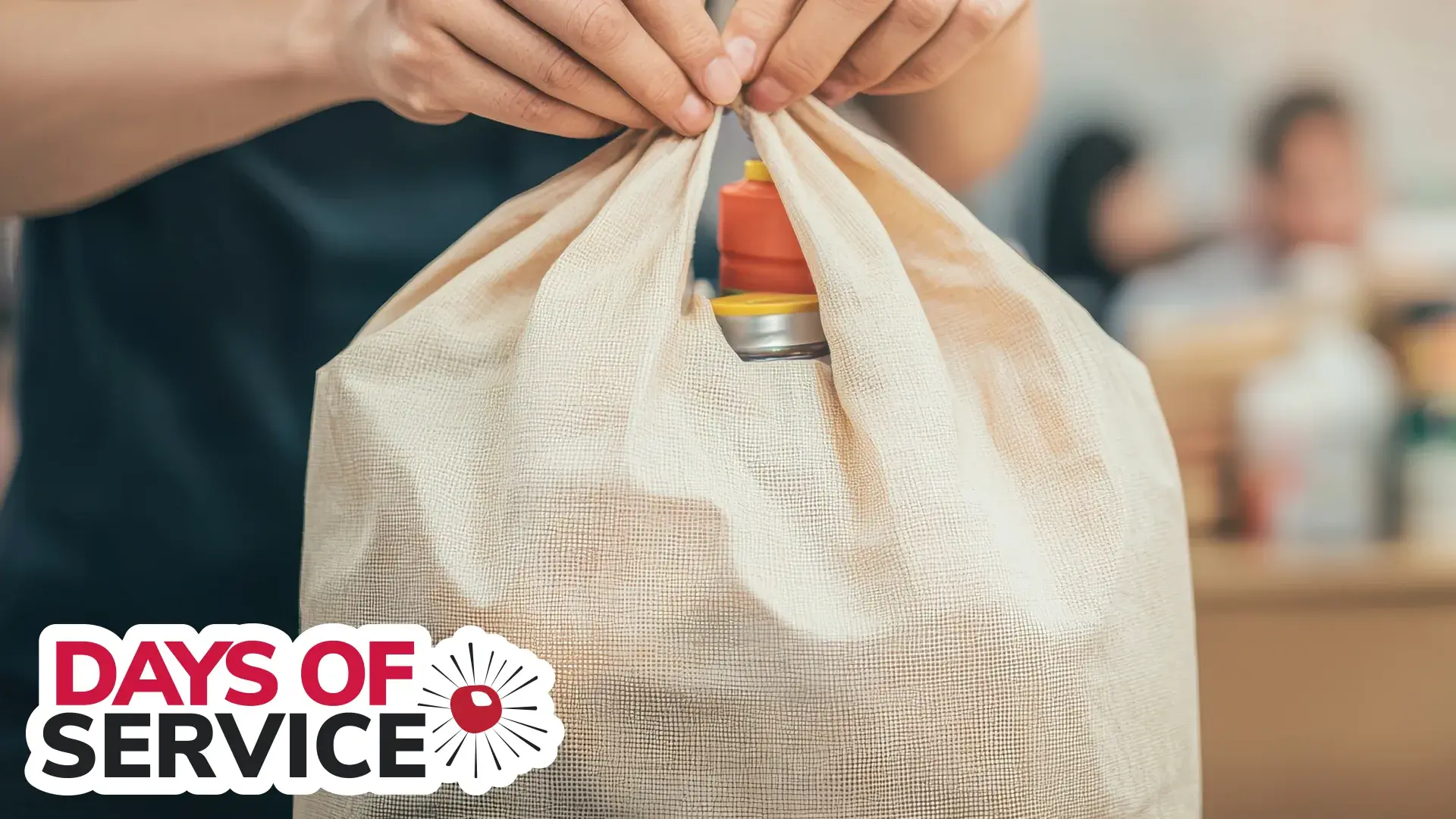 someone tying a bag of supplies