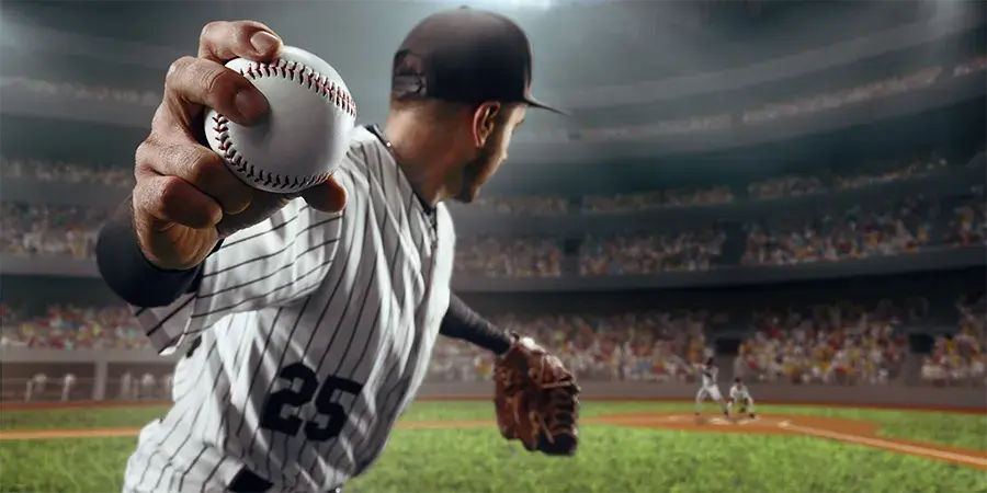Pitcher throwing a baseball in a stadium with a full crowd