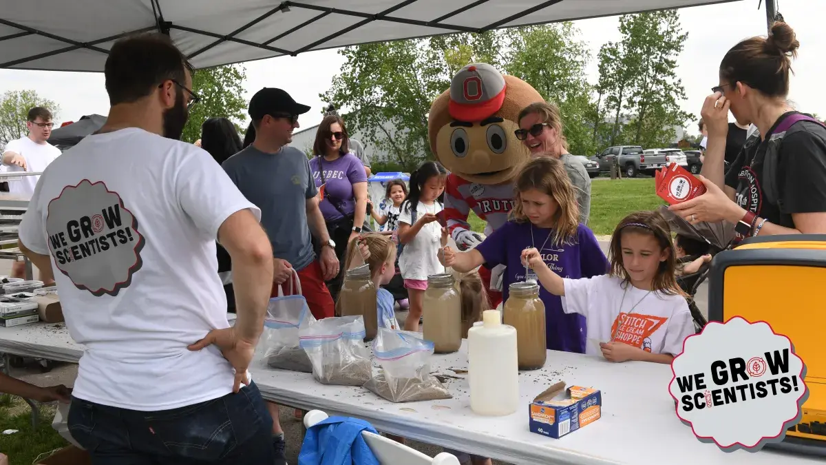 group of kids performing STEM activities
