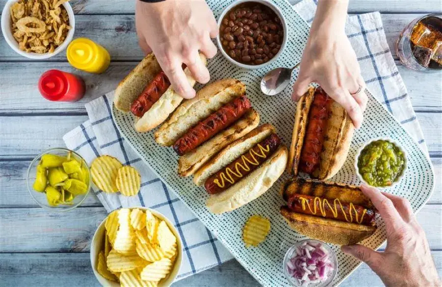 Hot dogs served on a picnic table