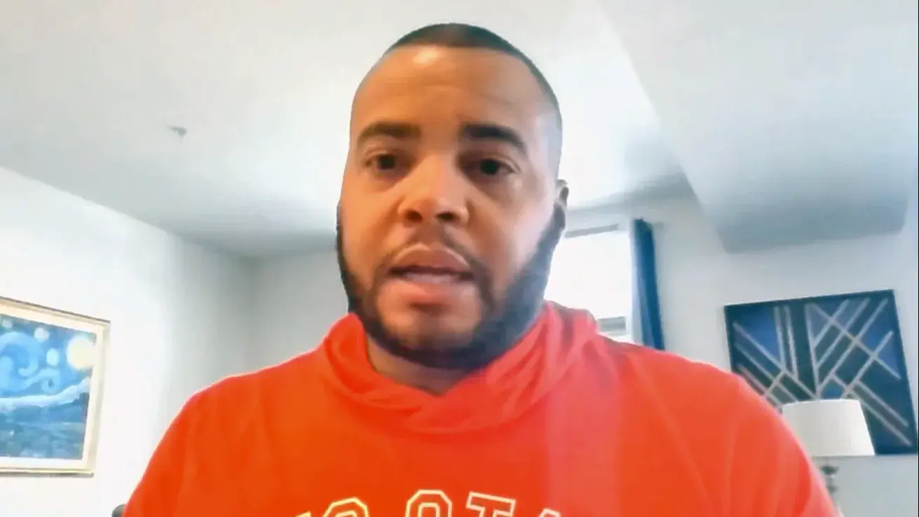 man wearing a scarlet sweatshirt