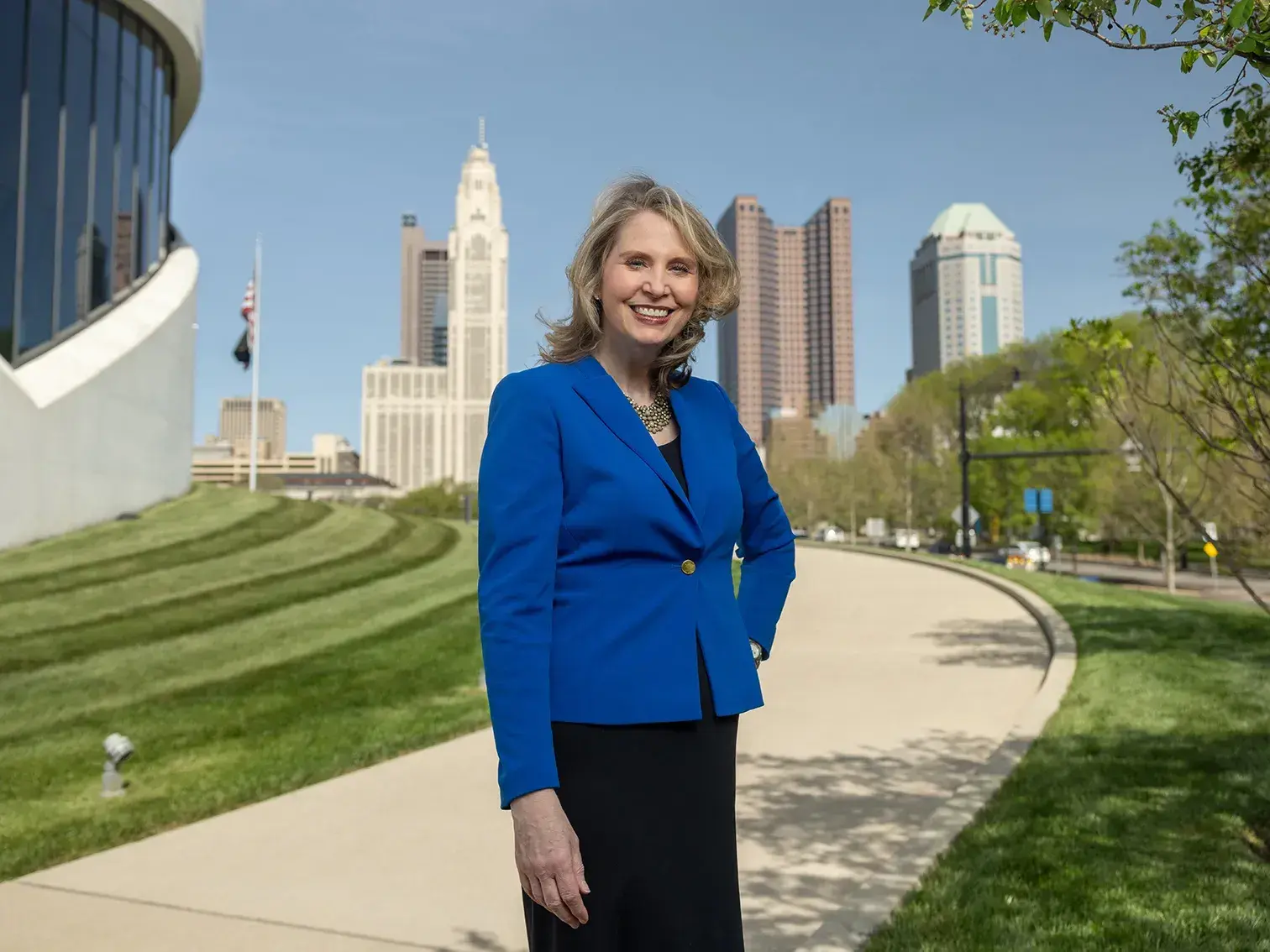 photo of Amy Edwards Taylor in front of the Columbus scioto mile and downtown high rise buildings