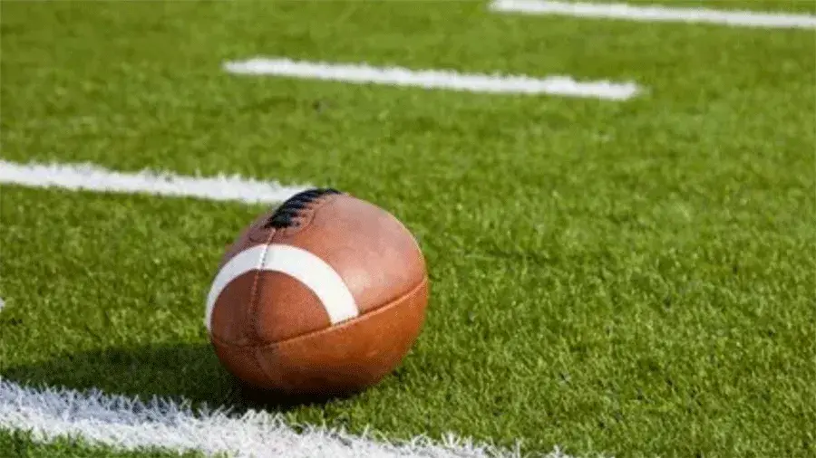 football sitting on green turf
