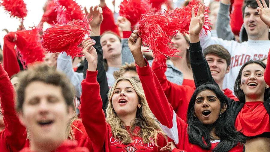 young people cheering at a Buckeye game