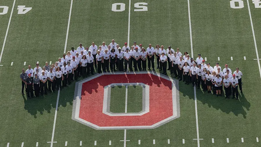 The Ohio State University Redcoats and Ushers standing on the 50 yard line at Ohio Stadium