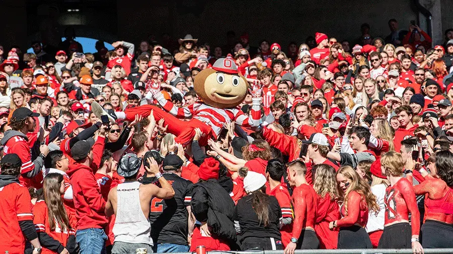 Brutus crowd surfing at a football game