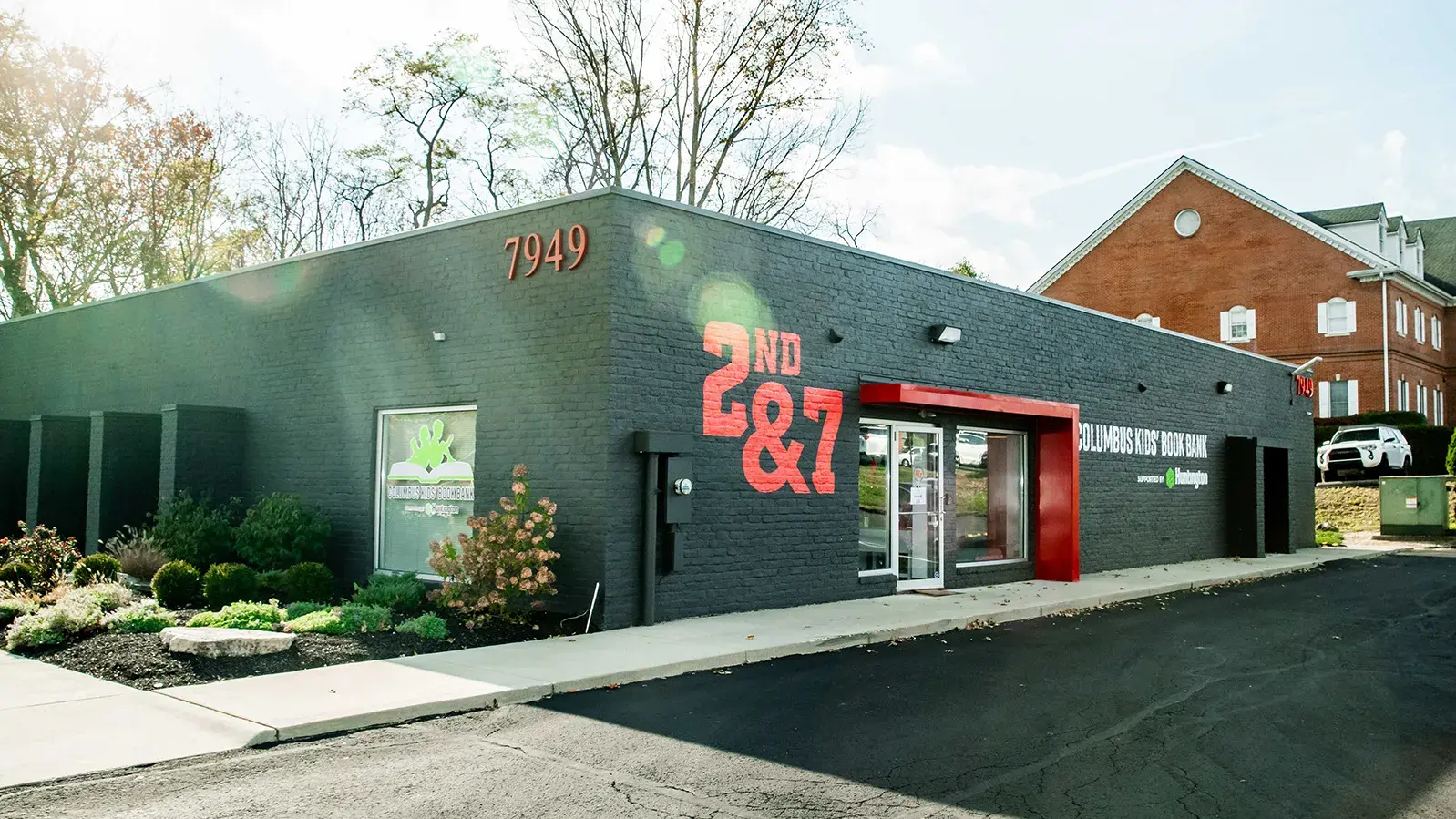 gray building with the phrase 2nd&amp;7 painted on it in scarlet 