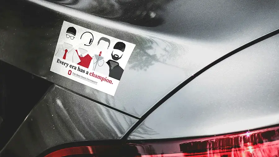 The Coaches Sticker on the back of a gray car