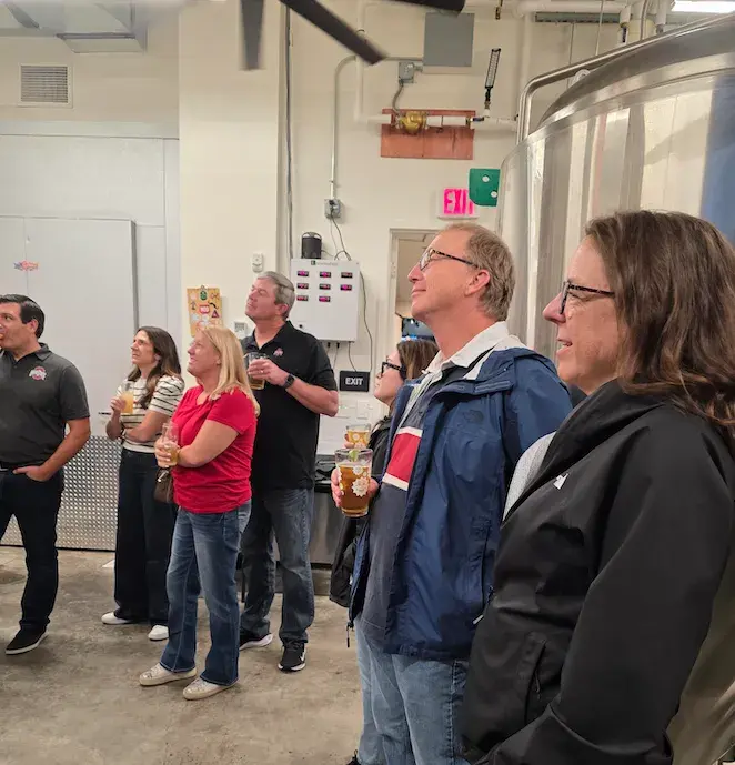 alumni watching a presentation at an event