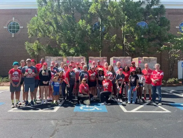 group photo of atlanta alumni club members standing outside at volunteer foodstock event