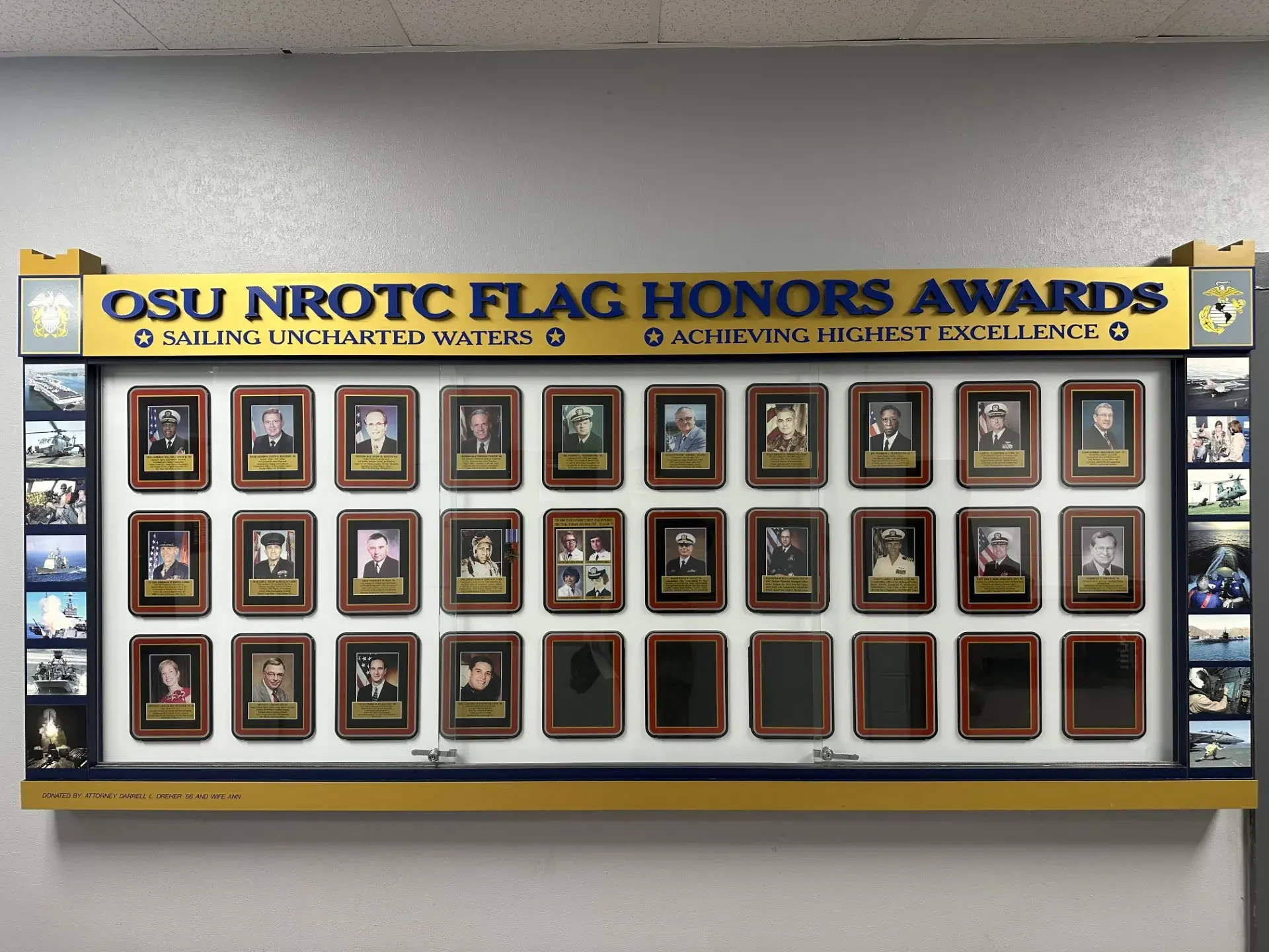 flag honors board in converse hall displaying pictures of those nominated 