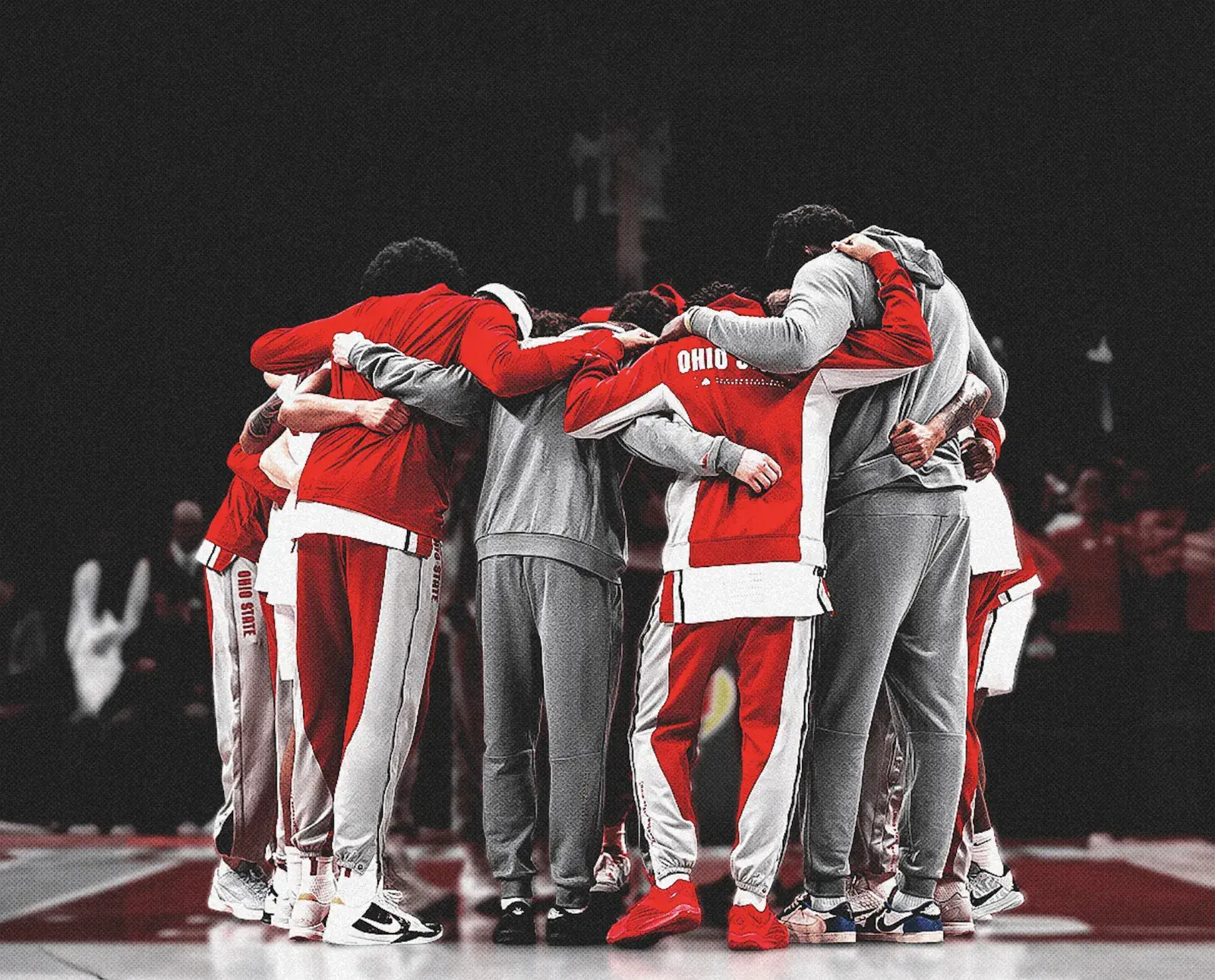 Varsity O basketball team huddling at a game