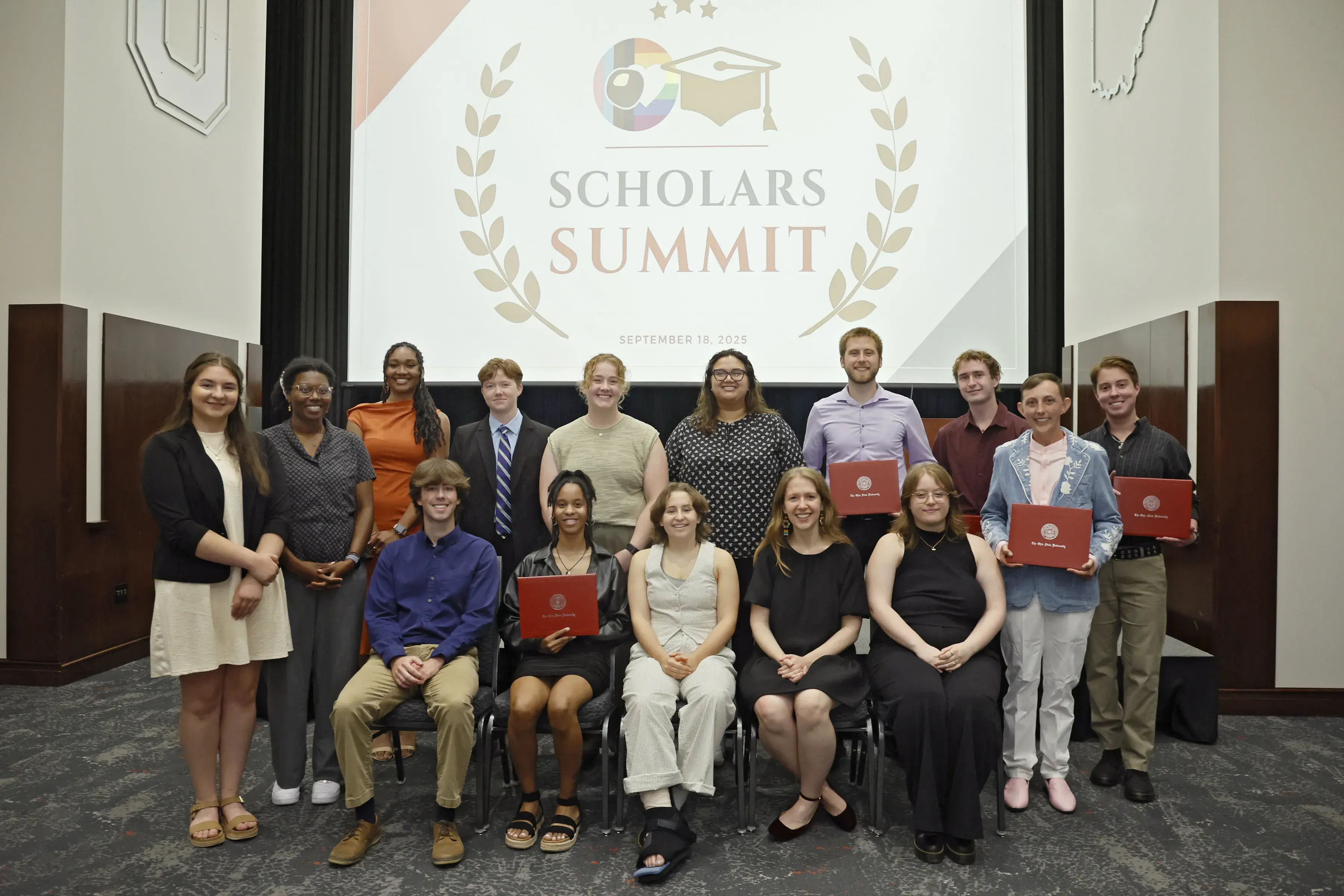 scholarship award recipients posing for photo with scholars summit background at LAH
