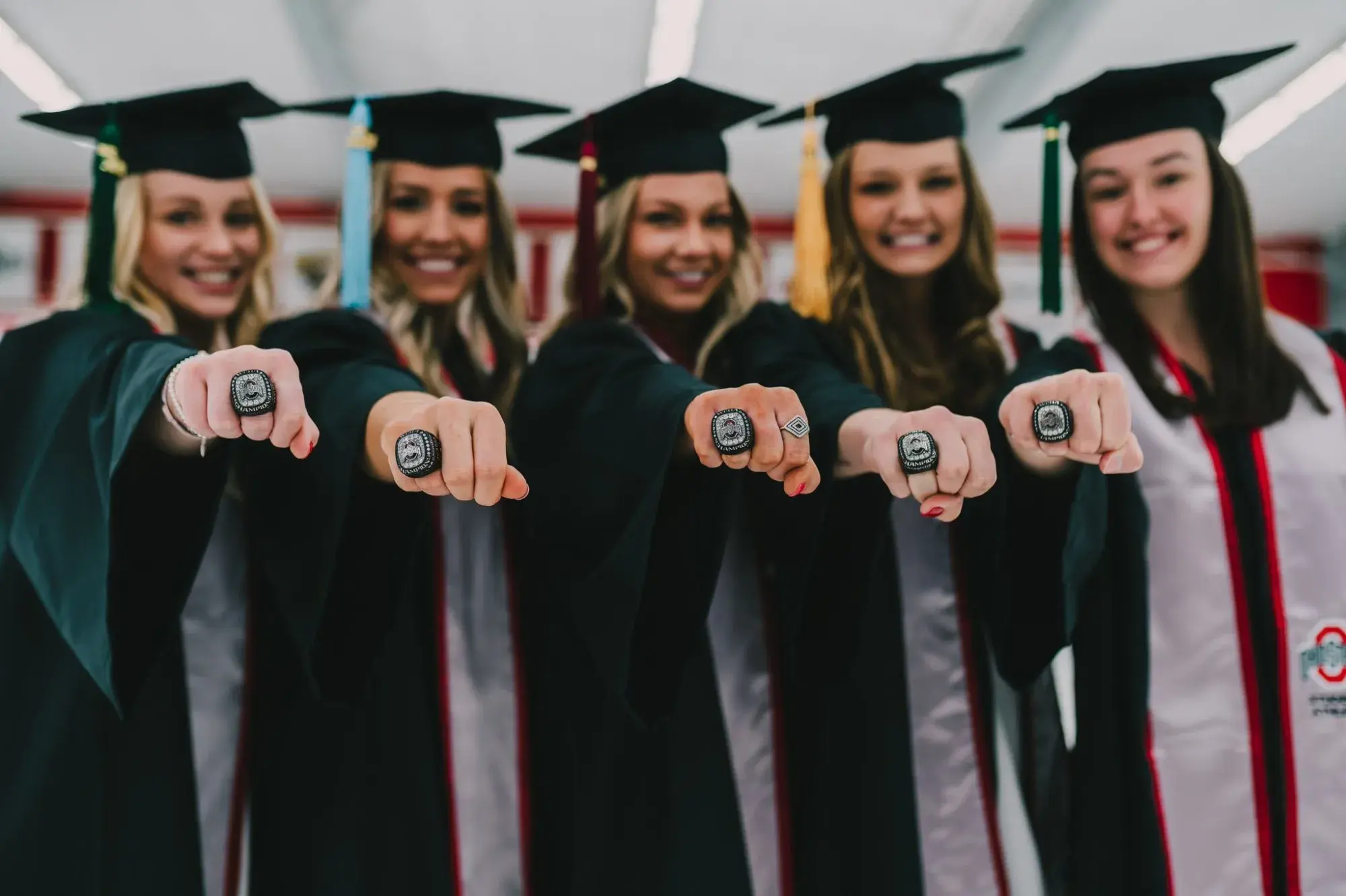Group of female graduates holding up their Ohio State rings