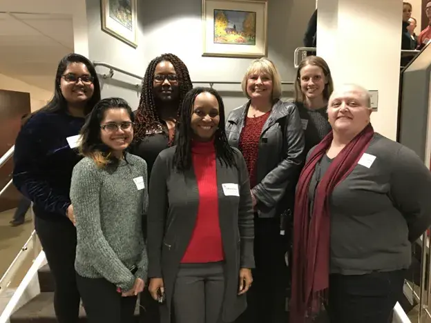 Group of women in STEM posting for a photo.