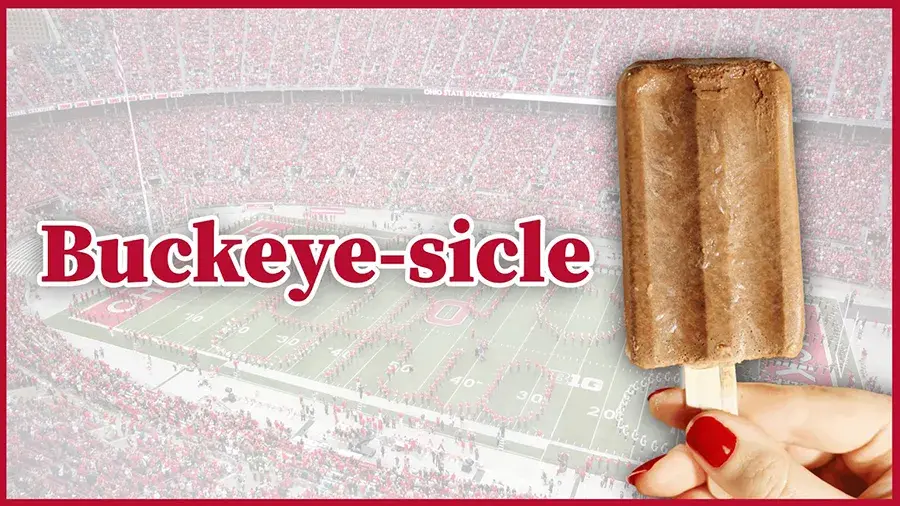 raphic showing a chocolate popsicle on a stick held in front of an Ohio State football stadium, with the word “Buckeye-sicle” in large red letters.