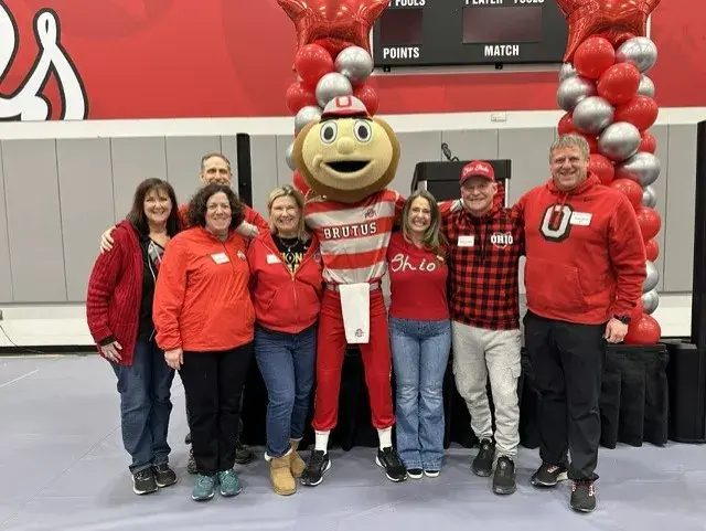 Group of alumni with Brutus.