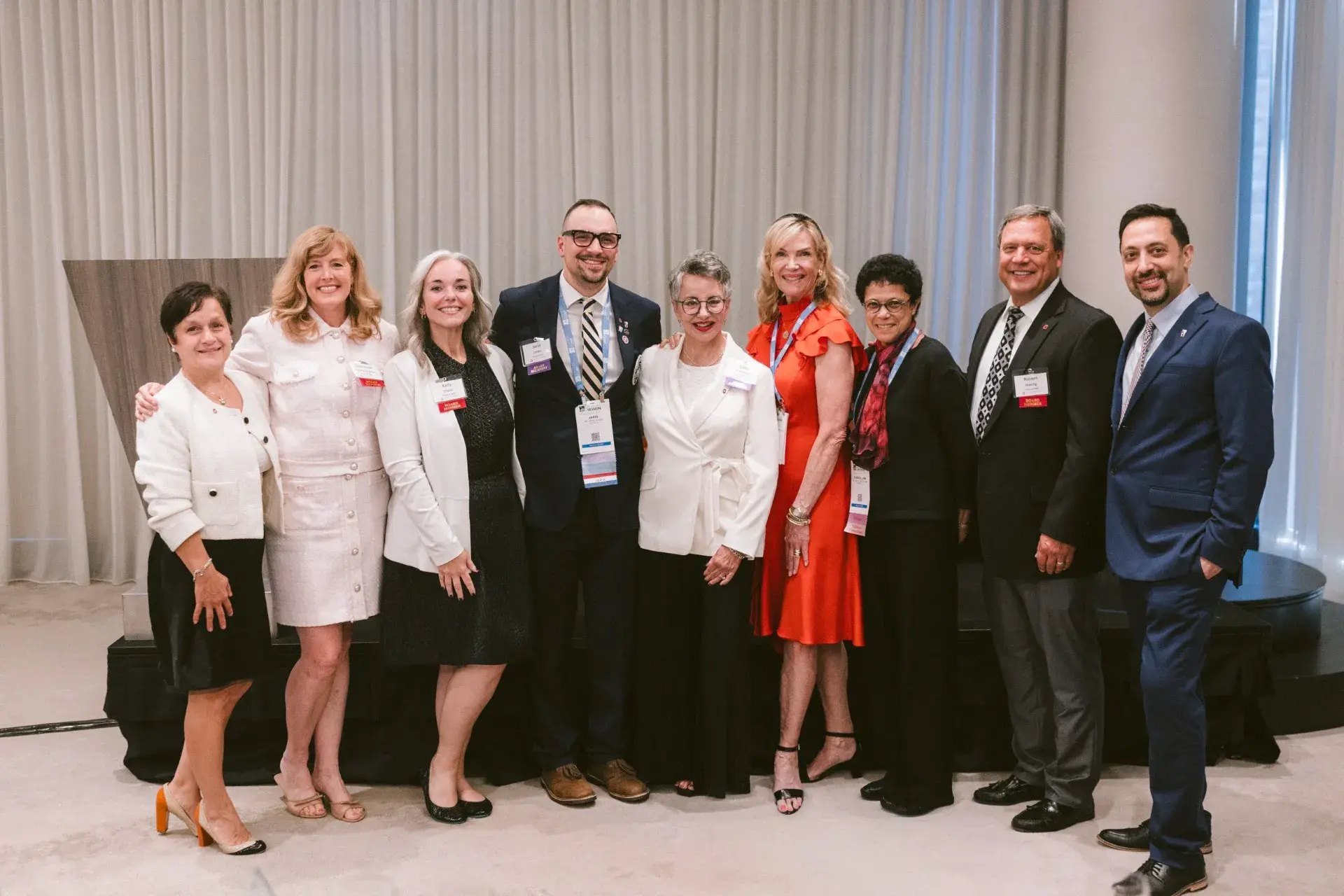 Dental Alumni Society Members standing together smiling at an event 