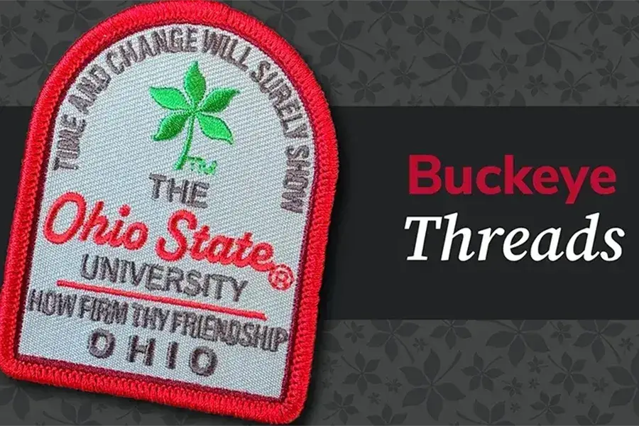 Buckeye Threads graphic featuring an embroidered Ohio State University patch with a red border and a green four-leaf clover, alongside the words “Buckeye Threads.”