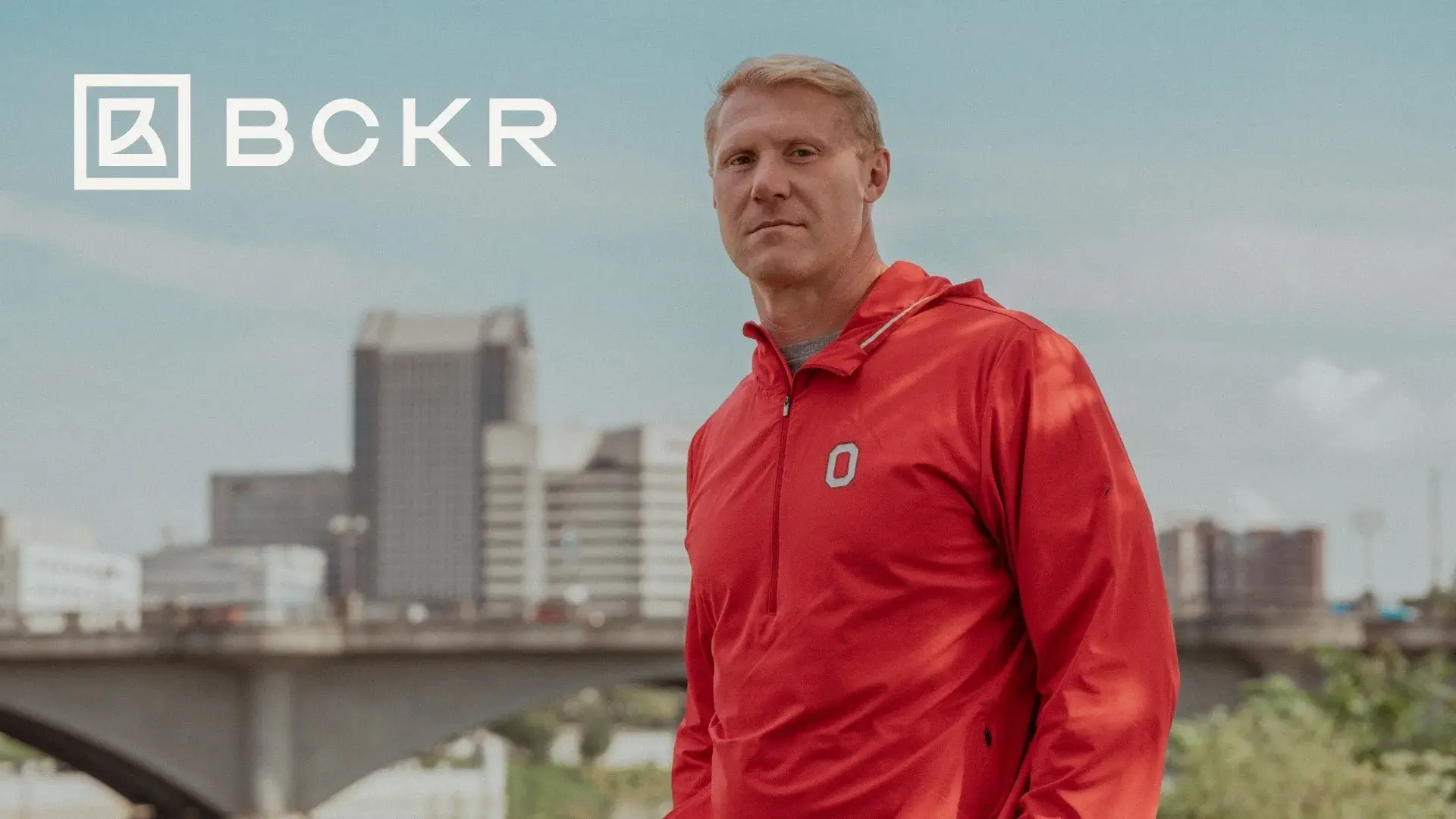 Guy posing in Ohio State red jacket for BCKR