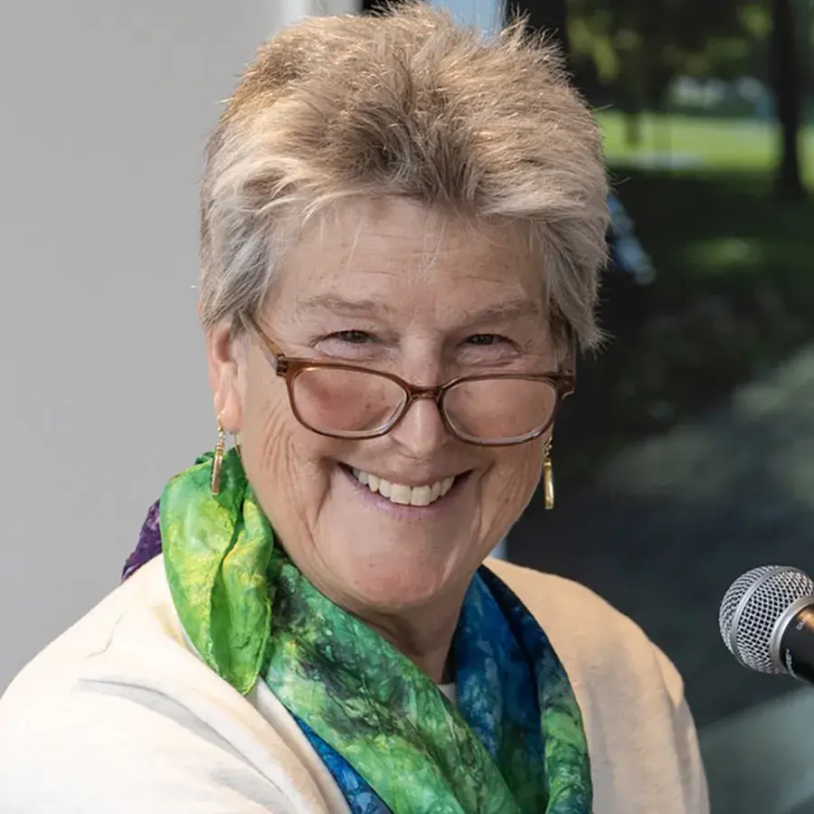 brown-haired woman with glasses