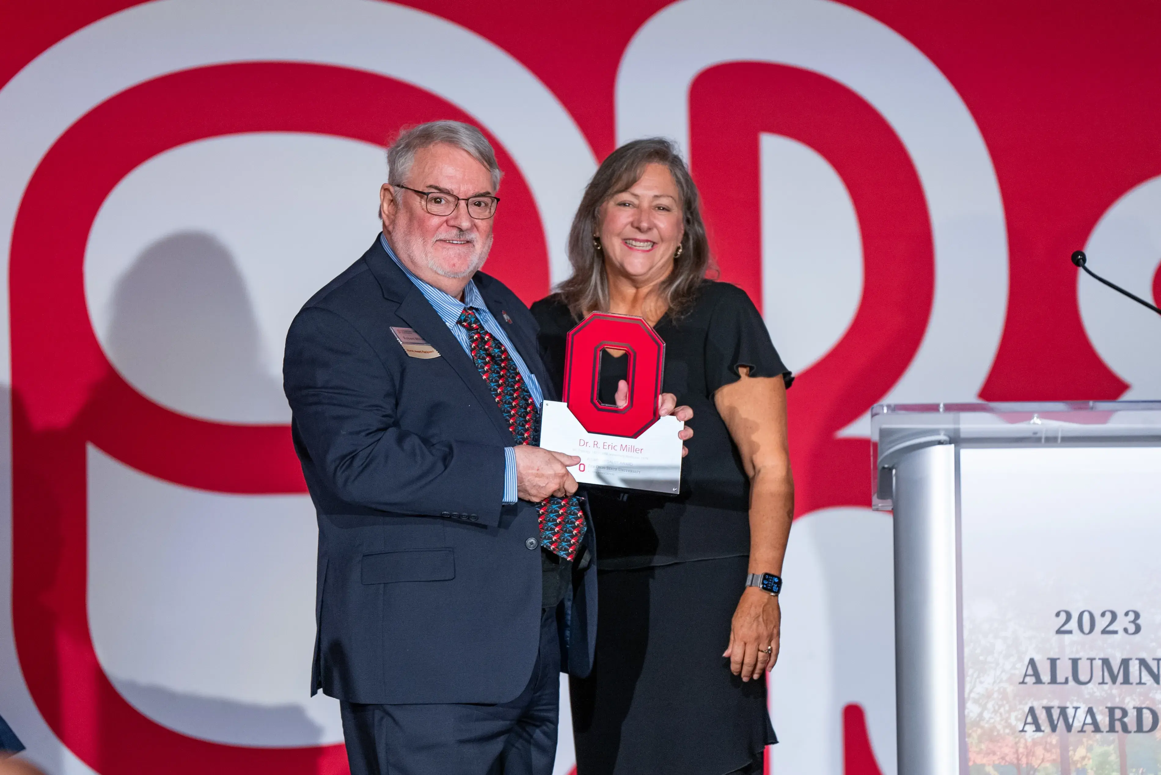 Alumni Medalist award winner Eric Miller with President Molly Ranz Calhoun