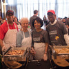 Ohio State president Michael V. Drake (left) and his wife, Brenda, join with staff at Ohio State's 2015 Thanksgiving dinner.