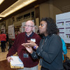 Mikafui Dzotsi explains her research project to judge David Nickel. Nickel is a former Ohio State lecturer and served as a judge at the 2018 Denman Forum.