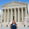 Gemma poses with a chain of buckeyes in front of the U.S. Supreme Court building.
