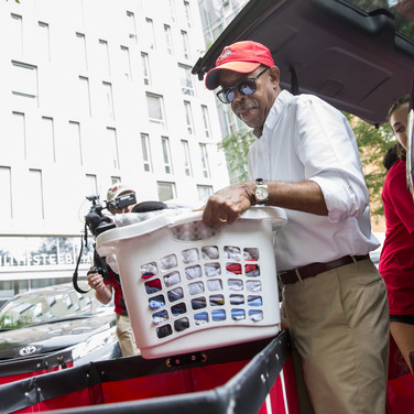 A firm grip by President Drake shows how firm thy friendship on move-in day.