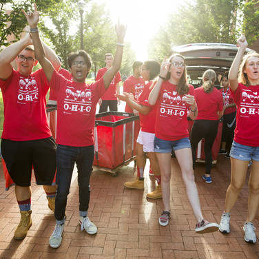 The day feels like a hoot as the Ohio State Welcome Leaders (OWLs), who volunteer to help on move-in day, gather outside every dormitory to cheer for each arriving family car.