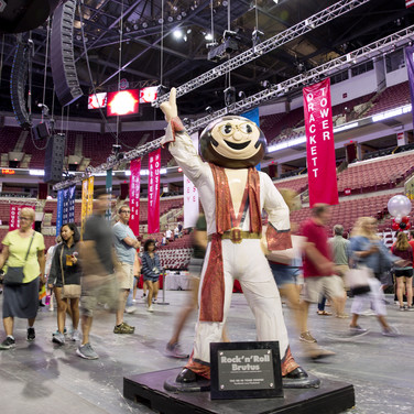 Brutus makes certain everyone feels like a rock star on center stage as paths converge on the floor of the basketball arena.