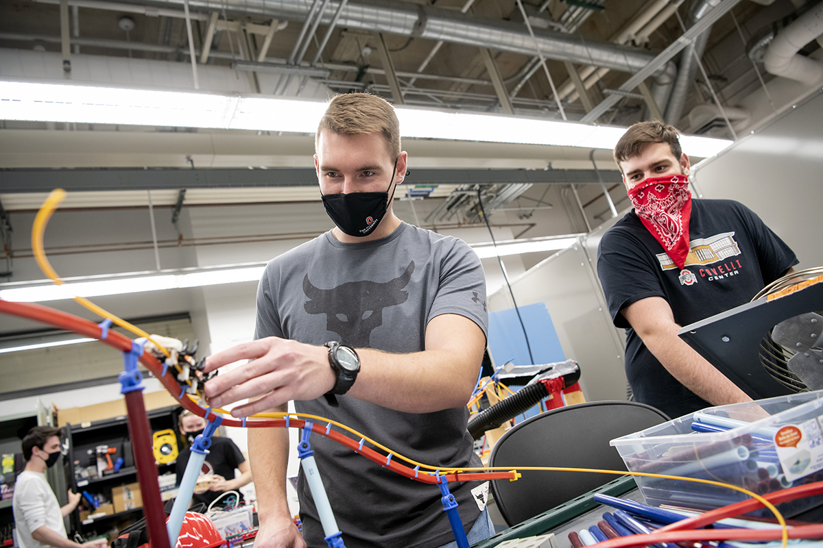 Ohio State students work on a roller coaster model.