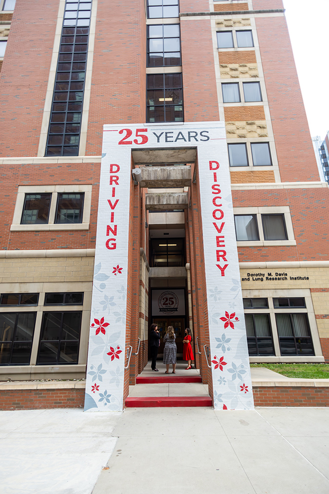 Outside of a building with the text 25 years driving, discovery on entrance