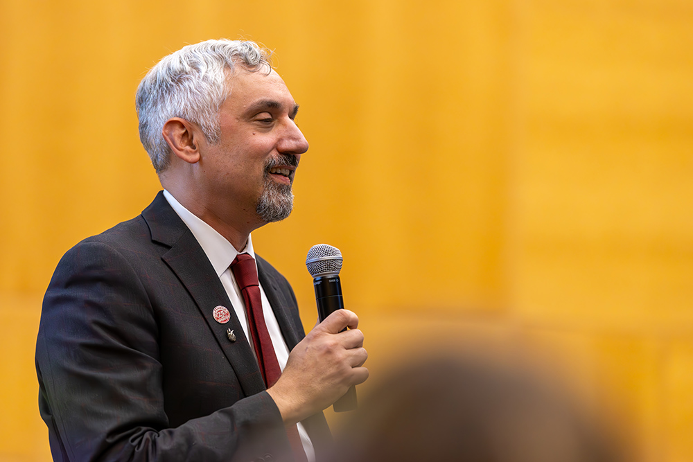 Man in a suit with a microphone