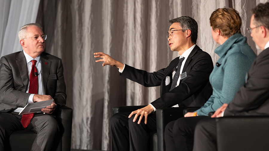Dr. Wu with other panel members on stage.