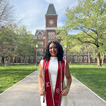Madison standing outside in front of University Hall.