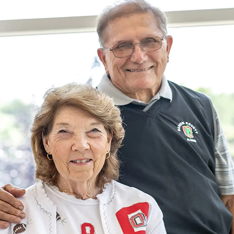 Ted and Marlene Temple wear Ohio State clothing and smile
