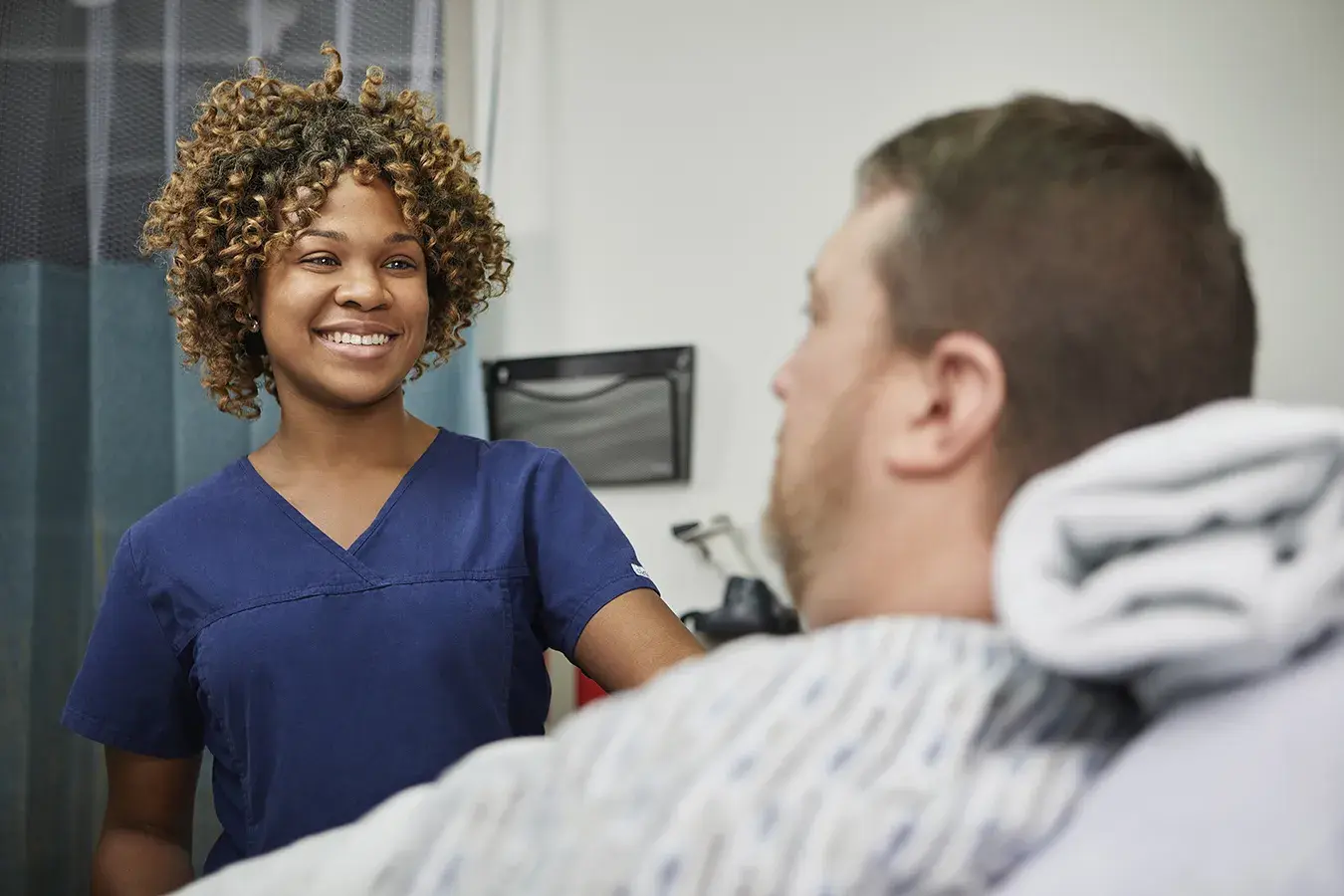 East Hospital PACU nurse with male patient