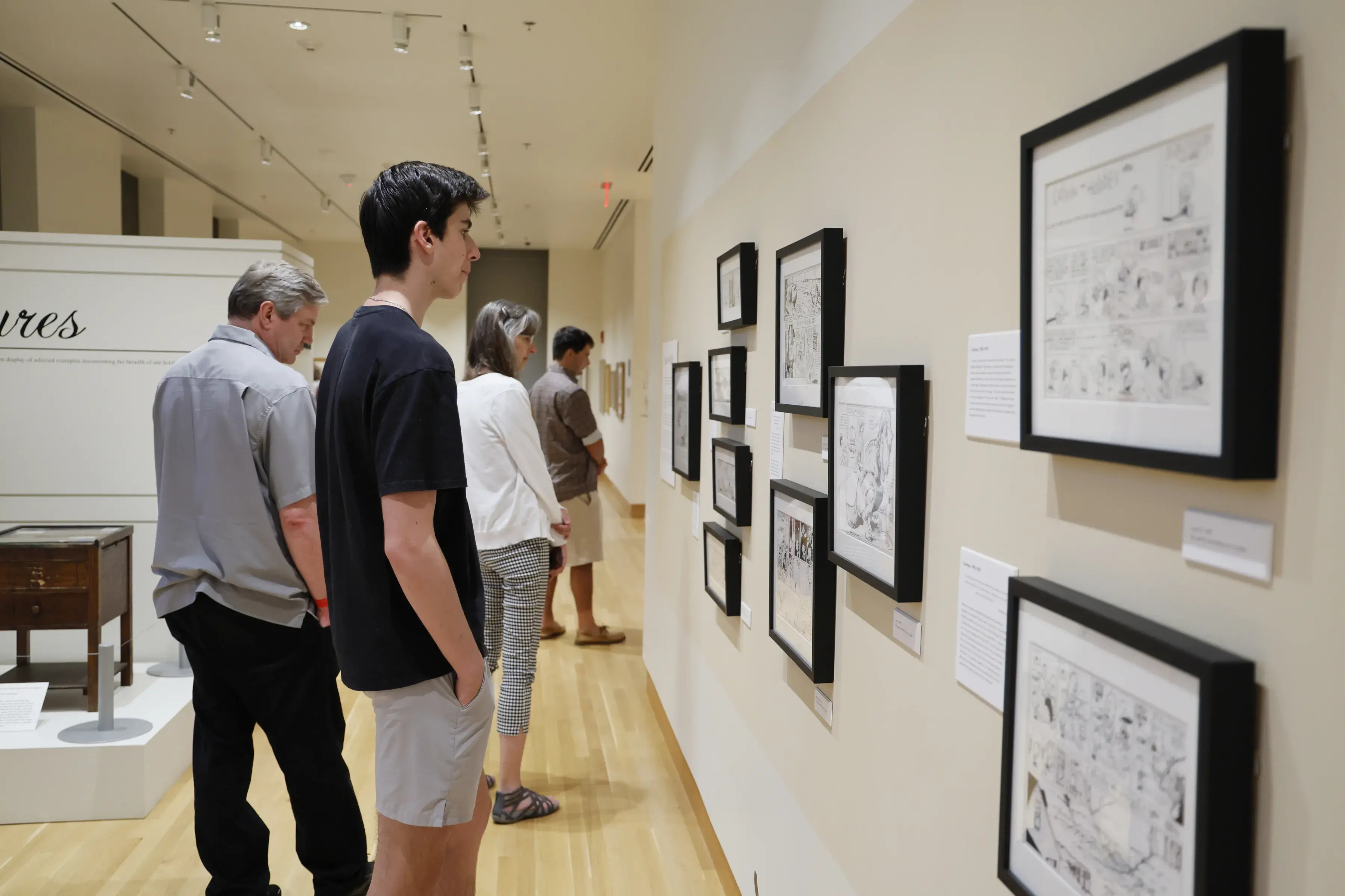 Parents and students exploring art work at the Billy Ireland Cartoon Library