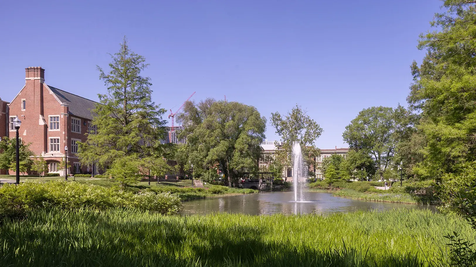 fountain surrounded by green grass on ohio state's campus